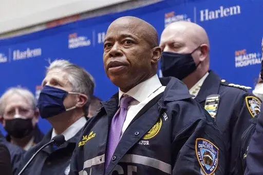 FILE — New York Mayor Eric Adams speaks during the press conference at Harlem Hospital after the shooting of a New York City Police Department officer, in Harlem, Friday, Jan. 21, 2022, in New York. Adams is set to propose Wednesday, April 20,  that the city spend $4.8 million to reach out to those most impacted by the so-called war on drugs.  (AP Photo/Yuki Iwamura File)