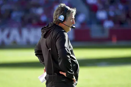 Mississippi State coach Mike Leach on the sidelines against Arkansas during an NCAA college football game Saturday, Nov. 6, 2021, in Fayetteville, Ark. Leach has signed a two-year contract extension through 2025 after leading the Bulldogs to their second consecutive bowl appearance, as confirmed by an MSU official on Wednesday, June 29, 2022. The third-year coach’s annual base salary increases from $5 million to $5.5 million. (AP Photo/Michael Woods, File)