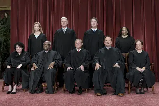 Members of the Supreme Court sit for a new group portrait following the addition of Associate Justice Ketanji Brown Jackson, at the Supreme Court building in Washington, Oct. 7, 2022. Bottom row, from left, Justice Sonia Sotomayor, Justice Clarence Thomas, Chief Justice John Roberts, Justice Samuel Alito, and Justice Elena Kagan. Top row, from left, Justice Amy Coney Barrett, Justice Neil Gorsuch, Justice Brett Kavanaugh, and Justice Ketanji Brown Jackson. The Supreme Court is adopting its first