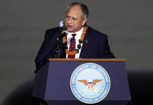 Navy Secretary Carlos Del Toro speaks at the 80th Pearl Harbor Anniversary ceremony at Joint Base Pearl Harbor-Hickam, Tuesday, Dec. 7, 2021, in Honolulu. Del Toro announced Thursday, May 19, 2022, that a future destroyer will be named USS Telesforo Trinidad in honor of a Filipino sailor who rescued two crew members when their ship caught fire more than a century ago. (AP Photo/Marco Garcia,File)