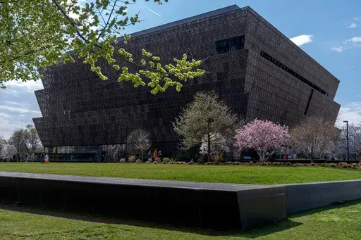 The National Museum of African American History and Culture on the National Mall is seen on Friday, March 28, 2025, in Washington. (AP Photo/Mark Schiefelbein)