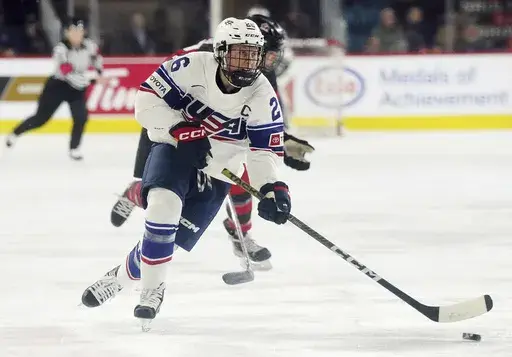 United States' Kendall Coyne Schofield skates with the puck against Canada during the first period of a Rivalry Series hockey game Nov. 17, 2022, in Kamloops, British Columbia. Coyne Schofield, a three-time Olympian and former U.S. captain, will suit up for Minnesota’s Professional Women's Hockey League opener at Boston on Jan. 3. The game will underline Coyne Schofield’s determination in returning to competitive play, after the birth of her son, now 6 months old. (Jesse Johnston/The Canadia