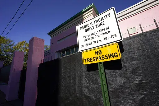 A sign indicating a "Medical Facility Quiet Zone" is displayed outside the Jackson Women's Health Organization clinic in Jackson, Miss., the state's only state licensed abortion facility, Wednesday, Nov. 18, 2020. According to a report from the Guttmacher Institute released on Tuesday, June 15, 2022, fewer women were getting pregnant and a larger share of them chose abortion. About one in five pregnancies ended in abortion in 2020. There were 3.6 million births, a decline between 2017 and 2020. 