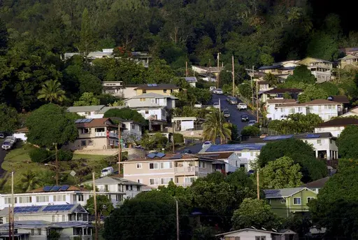 A neighborhood of single-family homes is shown Thursday, Dec. 24, 2015, in Honolulu. Two-thirds of the single family homes on Hawaii's most populous island have no hurricane protections. This year's return of El Nino is highlighting this weakness because it boosts the odds that more tropical cyclones will travel through Hawaii's waters this summer and fall. (AP Photo/Audrey McAvoy, File)