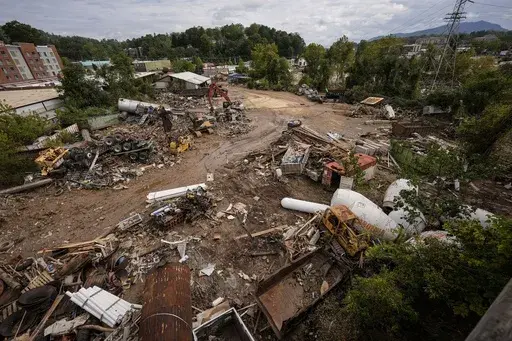 Debris is visible in the aftermath of Hurricane Helene, Sept. 30, 2024, in Asheville, N.C. (AP Photo/Mike Stewart, File)