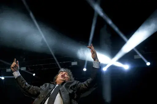 Presidential candidate of the Liberty Advances coalition Javier Milei waves to supporters during a campaign rally in Buenos Aires, Argentina, Wednesday, Oct. 18, 2023. General elections are set for Oct. 22. (AP Photo/Natacha Pisarenko)