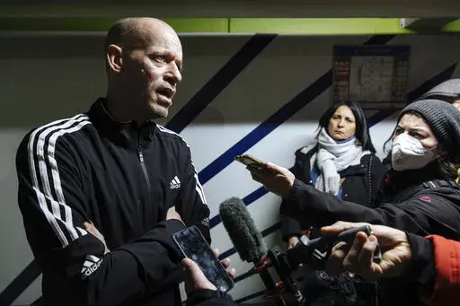 Palestinian French lawyer and activist Salah Hammouri talks with the press as he arrives at the Charles de Gaulle Airport after his extradition from Israel to France, Sunday, Dec. 18, 2022, in Paris. Israel said it deported Hammouri to France early Sunday, claiming he has ties to a banned militant group, despite objections from the French government. (AP Photo/Lewis Joly)