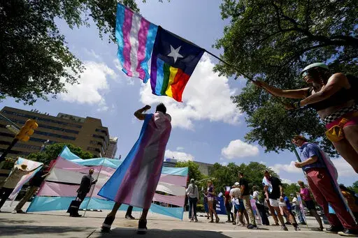 Demonstrators gather on the steps to the State Capitol to speak against transgender-related legislation bills being considered in the Texas Senate and Texas House, May 20, 2021 in Austin, Texas. No texts or emails that leave paper trails. Unusually close oversight. Texas child welfare workers who have quit over Republican Gov. Greg Abbott's first-of-its-kind directive in the U.S. to investigate families of transgender youth for abuse say rushed new protocols appear designed to tilt the outcome o