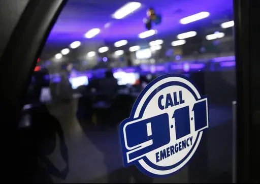 A police 911 call center is pictured on May 3, 2019, in Dallas. Emergency call center workers say their centers are understaffed, struggling to hire new staff and plagued by worker burnout, according to a national survey released Tuesday, July 25, 2023. (Rose Baca/The Dallas Morning News via AP, File)