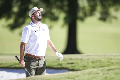 Hubbard looks to the ninth green from the sand trap during the third round of the Sanderson Farms Championship golf tournament in Jackson, Miss., Saturday, Oct. 1, 2022. (James Pugh/impact601.com via AP)