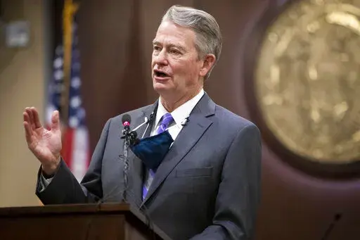 In this Oct. 1, 2020, file photo, Idaho Gov. Brad Little gestures during a press conference at the Statehouse in Boise, Idaho. Idaho on Wednesday, March 23, 2022, became the first state to enact a law modeled after a Texas statute banning abortions after about six weeks of pregnancy and allowing it to be enforced through civil lawsuits to avoid constitutional court challenges. (Darin Oswald/Idaho Statesman via AP, File)