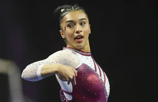 Alabama's Luisa Blanco competes on the floor exercise during an NCAA gymnastics meet on Jan. 6, 2024 in Las Vegas. Blanco, who will compete for Colombia at the Paris Olympics, is considering extending her career by participating in the Global Impact Gymnastics Alliance, a start-up professional league that is hoping to start holding events in 2025. (AP Photo/Stew Milne, file)