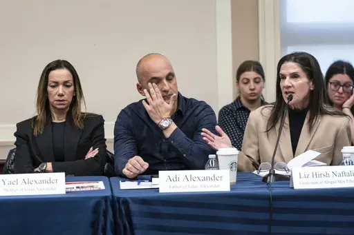 From left, Yael and Adi Alexander, parents of Eden Alexander, who was abducted and brought to Gaza on Oct. 7, 2023, listen to Liz Hirsh Naftali, great aunt of Abigail More Edan, as families and victims of the Hamas attacks meet with the House Foreign Affairs Committee, at the Capitol in Washington, Nov. 29. (AP Photo/J. Scott Applewhite, File)