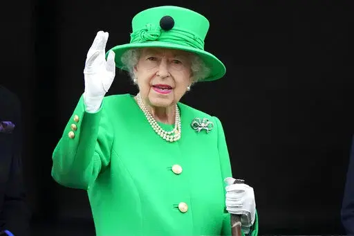 Britain's Queen Elizabeth II waves to the crowd during the Platinum Jubilee Pageant at the Buckingham Palace in London, June 5, 2022, on the last of four days of celebrations to mark the Platinum Jubilee. Queen Elizabeth II's death in September 2022 was arguably the most high-profile death this year. In her 70 years on the British throne, she helped modernize the monarchy across decades of enormous social change, royal marriages and births, and family scandals. For most Britons, she was the only