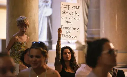 Demonstrators stand outside the House chamber before a vote is held on Senate Bill 1 during a special session Friday, Aug. 5, 2022, at the Indiana Statehouse in Indianapolis. Critics of religious freedom laws often argue they are used to discriminate against LGBTQ people and only protect a conservative Christian worldview. But following the U.S. Supreme Court’s overturning of Roe v. Wade in June, religious abortion-rights supporters are using these laws to protect access to abortion and defend