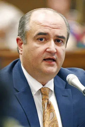 John Davis, then executive director of the Mississippi Department of Human Services, answers lawmakers' questions at the state Capitol in Jackson, Miss., on Sept. 7, 2016. Davis pleaded not guilty, in April 2022, to charges of bribery, conspiracy and making false statements to the government about alleged misspending of federal money that was intended to help poor people. (AP Photo/Rogelio V. Solis, File)