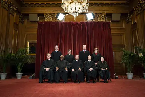 Members of the Supreme Court pose for a group photo at the Supreme Court in Washington, April 23, 2021. Seated from left are Associate Justice Samuel Alito, Associate Justice Clarence Thomas, Chief Justice John Roberts, Associate Justice Stephen Breyer and Associate Justice Sonia Sotomayor, Standing from left are Associate Justice Brett Kavanaugh, Associate Justice Elena Kagan, Associate Justice Neil Gorsuch and Associate Justice Amy Coney Barrett. Judge Ketanji Brown Jackson will join a Supreme