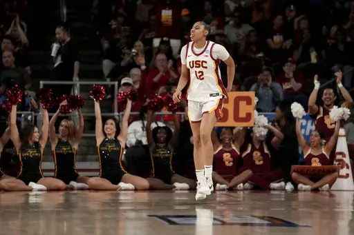 Southern California guard JuJu Watkins (12) reacts after making a shot during the second half against UNC Greensboro in the first round of the NCAA college basketball tournament Saturday, March 22, 2025, in Los Angeles. (AP Photo/Eric Thayer)