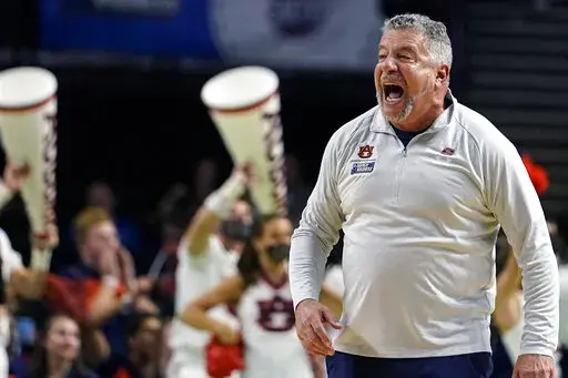 Auburn head coach Bruce Pearl yells towards his players during the first half of a college basketball game in the second round of the NCAA tournament against Miami, Sunday, March 20, 2022, in Greenville, S.C. (AP Photo/Brynn Anderson)