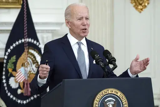 President Joe Biden speaks about the 2021 jobs report in the State Dining Room of the White House, Friday, Jan. 7, 2022, in Washington. (AP Photo/Alex Brandon)