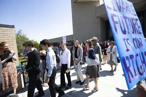 Youth plaintiffs in the Held v. Montana climate case leave the Montana Supreme Court, on July 10, 2024, in Helena, Mont. (Thom Bridge/Independent Record via AP, File)