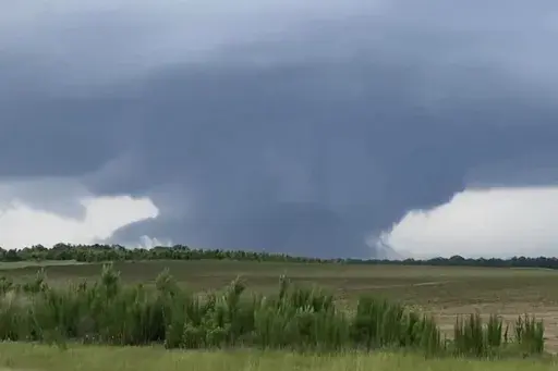 This screenshot taken from a video shows a tornado on June 14, 2023, in Blakely, Ga. Officials from Texas to Georgia are reporting damaging winds and possible tornadoes as a powerful storm system crosses the South. (Rand McDonald via AP)
