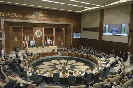 In this photo released by Egypt's Ministry of Foreign Affairs, delegates and foreign ministers of member states convene at the Arab League headquarters in Cairo, Egypt, Sunday, May 7, 2023. The ministers are voting on restoring Syria's membership to the organization after it was suspended over a decade ago. The meeting comes after a rapid rapprochement between Syria and regional governments since February. (Egyptian Ministry of Foreign Affairs via AP)