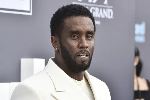 Music mogul and entrepreneur Sean "Diddy" Combs arrives at the Billboard Music Awards, May 15, 2022, in Las Vegas. Two properties belonging to Combs’ in Los Angeles and Miami were searched Monday, March 25, 2024, by federal Homeland Security Investigations agents and other law enforcement as part of an ongoing sex trafficking investigation, two law enforcement officials told The Associated Press. (Photo by Jordan Strauss/Invision/AP, File)
