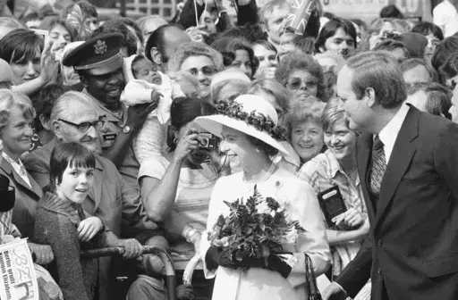People gather to greet Britain's Queen Elizabeth II as she walked along the famous Kurfuerstendamm Boulevard in West Berlin, Germany, on May 24, 1978. One would like two horses. That, in effect, was the gift requested by Britain's Queen Elizabeth II during her state visit to Germany in 1978, weekly Der Spiegel reported Monday, March 27, 2023. (AP Photo, File)