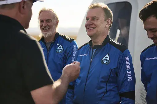 In this photo provided by Blue Origin, NS-21 (New Shepard-21), astronaut Hamish Harding receives his Blue Origin astronaut pin after a successful flight to space on June 4, 2022, in Van Horn, Texas. According to Action Aviation, a company for which Harding serves as chairman, the U.K. businessman was one of the mission specialists onboard a missing submersible carrying five people to view the wreckage of the Titanic that was reported overdue late Sunday, June 18, 2023. (Felix Kunze/Blue Origin v