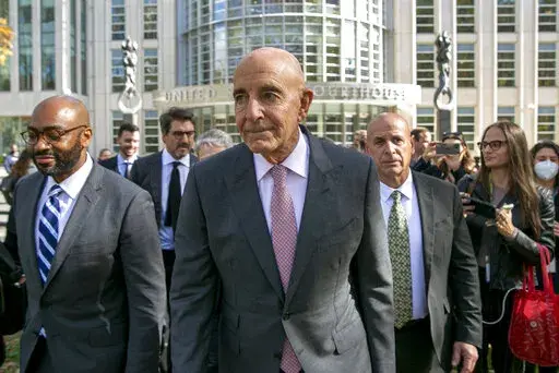Tom Barrack, center, leaves Brooklyn Federal Court, Friday, Nov. 4, 2022, in New York. Barrak, former President Donald Trump's inaugural committee chair, was acquitted of all counts Friday at a federal trial in which he was accused of using his personal access to the former president to secretly promote the interests of the United Arab Emirates.  (AP Photo/Ted Shaffrey)