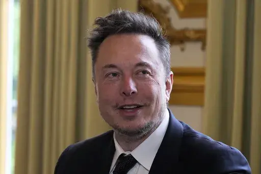Twitter, now X. Corp, and Tesla CEO Elon Musk poses before his talks with French President Emmanuel Macron on Monday, May 15, 2023, at the Elysee Palace in Paris. A top European Union official is visiting Silicon Valley to oversee “stress tests” for Twitter before the bloc’s tough new digital rules take effect. Thierry Breton, who oversees digital policy, is the EU’s point person working to get Big Tech companies in line for the Digital Services Act, which kicks in Aug. 25. (AP Photo/Mic