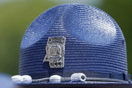 The emblem of a Mississippi Highway Patrol badge is shown on a hat worn by uniformed officers during a ceremony, June 30, 2021, in Pearl, Miss. Mississippi's Department of Public Safety is investigating an allegation that a state trooper filmed a sexual encounter she had with an intoxicated woman and circulated it throughout the agency without the woman's consent. (AP Photo/Rogelio V. Solis, File)