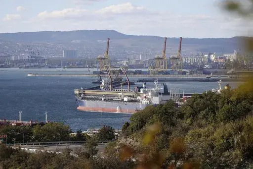 An oil tanker is moored at the Sheskharis complex, part of Chernomortransneft JSC, a subsidiary of Transneft PJSC, in Novorossiysk, Russia, on Oct. 11, 2022, one of the largest facilities for oil and petroleum products in southern Russia. For months after Ukraine's Western allies limited sales of Russian oil to $60 per barrel, the price cap was still largely symbolic. Most of Moscow's crude — its main moneymaker — cost less than that.(AP Photo, File)