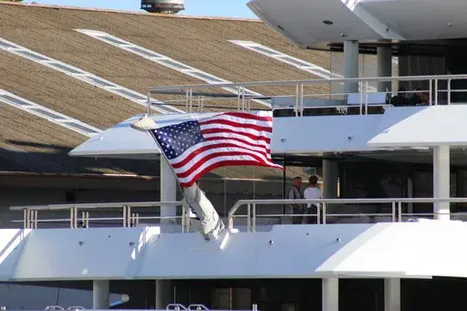 The superyacht Amadea is moored in Honolulu on Thursday, June 16, 2022. A Russian-owned superyacht seized by the United States arrived in Honolulu Harbor flying a U.S. flag after the U.S. last week won a legal battle in Fiji to take the $325 million vessel. (AP Photo/Audrey McAvoy)