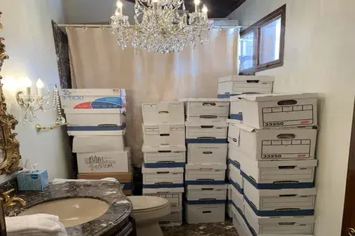 This image, contained in the indictment against former President Donald Trump, shows boxes of records stored in a bathroom and shower in the Lake Room at Trump's Mar-a-Lago estate in Palm Beach, Fla. The classified documents investigation of Donald Trump appeared to have clear momentum in 2022 when FBI agents who searched the former president’s Mar-a-Lago estate recovered dozens of boxes containing sensitive documents. But each passing day brings mounting doubts that the case can reach trial t