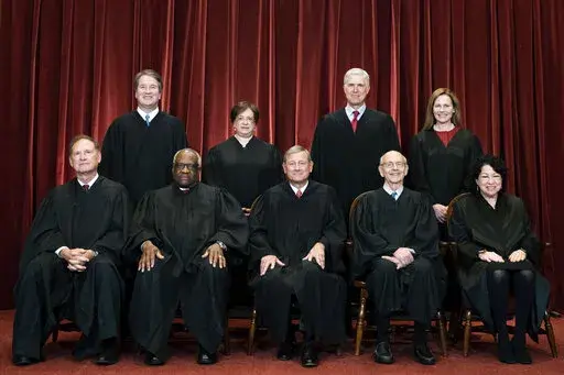 Members of the Supreme Court pose for a group photo at the Supreme Court in Washington, April 23, 2021. Seated from left are Associate Justice Samuel Alito, Associate Justice Clarence Thomas, Chief Justice John Roberts, Associate Justice Stephen Breyer and Associate Justice Sonia Sotomayor, Standing from left are Associate Justice Brett Kavanaugh, Associate Justice Elena Kagan, Associate Justice Neil Gorsuch and Associate Justice Amy Coney Barrett. The Supreme Court is refusing to say whether th
