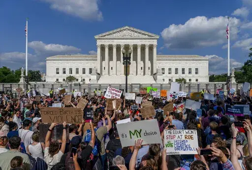 Abortion-rights and anti-abortion demonstrators gather outside of the Supreme Court in Washington, Friday, June 24, 2022. The Supreme Court has ended constitutional protections for abortion that had been in place nearly 50 years, a decision by its conservative majority to overturn the court's landmark abortion cases. (AP Photo/Gemunu Amarasinghe)