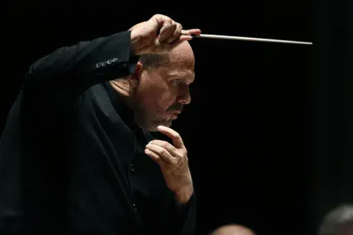 In this Jan. 8, 2015, photo, Jaap van Zweden conducts the Dallas Symphony Orchestra in Dallas. Jaap van Zweden will conduct Mahler’s Second Symphony in his farewell concerts as the New York Philharmonic’s music director from June 6-8, 2024, ending a season that will spotlight the 100th anniversary of the orchestra’s Young People’s Concerts. Van Zweden succeeded Alan Gilbert as music director in the 2018-19 season and announced in September 2021 that the 2023-24 season will be his last. (
