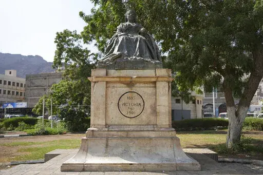 A historical statue of Queen Victoria sits in a central square in Aden, Yemen on Tuesday, Sept. 13, 2022. The death of Queen Elizabeth II has prompted some Yemenis to remember British colonial rule that oppressed many and deepened divisions inside the country. Since Aden gained independence in 1967, it has turned into the country's second capital amid a brutal years-long civil war. (AP Photo/Alaa Noman)