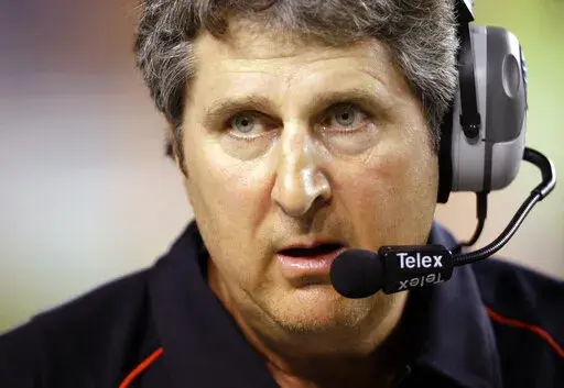 Texas Tech coach Mike Leach waits as a play is reviewed during the first quarter of their NCAA college football game against Texas in Austin, Texas, Sept. 19, 2009. Mike Leach, the gruff, pioneering and unfiltered college football coach who helped revolutionize the passing game with the Air Raid offense, has died following complications from a heart condition, Mississippi State said Tuesday, Dec. 13, 2022. He was 61. (AP Photo/Eric Gay, File)