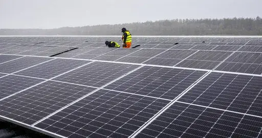 Solar panels are installed at a floating photovoltaic plant on a lake in Haltern, Germany, on April 1, 2022. Russia's Gazprom says it is halting natural gas supplies to Poland and Bulgaria, escalating tensions between the Kremlin and Europe over energy and Russia's invasion of Ukraine — and adding new urgency to plans to reduce and then end the continent's dependence on Russia as a supplier of oil and gas. (AP Photo/Martin Meissner)