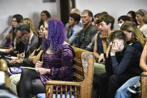 Plaintiffs listen to testimony during a hearing in the climate change lawsuit, Held vs. Montana, at the Lewis and Clark County Courthouse, Tuesday, June 13, 2023, in Helena, Mont. The 16 young plaintiffs and their attorneys are trying to persuade a judge that the state’s allegiance to fossil fuel development endangers the young people’s health and livelihoods and those of future generations. (Thom Bridge/Independent Record via AP)