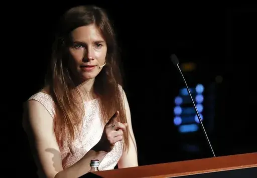 Amanda Knox speaks at a Criminal Justice Festival at the University of Modena, Italy, Saturday, June 15, 2019. Knox faces yet another trial for slander in a case that could remove the last remaining guilty verdict against her eight years after Italy's highest court definitively threw out her conviction for the murder of her 21-year-old British roommate, Meredith Kercher. (AP Photo/Antonio Calanni)