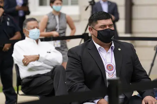 Cyrus Ben, chief of the Mississippi Band of Choctaw Indians, watches with other Mississippi flag commission members as proposed state flag designs are flown outside the Old Capitol Museum in Jackson, Miss., Aug. 25, 2020. The tribe announced on Tuesday, June 6, 2023, that Ben had won a second term as chief. (AP Photo/Rogelio V. Solis, File)