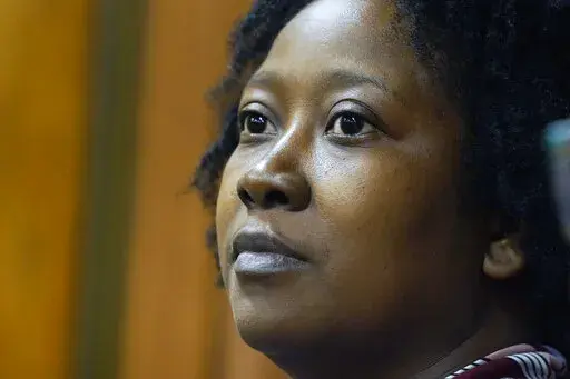 Tanya Marsaw, a parent of four with one child in a public middle school, and a member of Parents For Public Schools, listens as attorneys for the nonprofit group present arguments in Hinds County Chancery Court, in Jackson, Miss., Tuesday, Aug. 23, 2022, in a lawsuit claiming the state is violating its own constitution with a federally funded grant program for private schools. (AP Photo/Rogelio V. Solis)