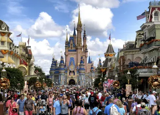 Crowds fill Main Street USA in front of Cinderella Castle at the Magic Kingdom on the 50th anniversary of Walt Disney World in Lake Buena Vista, Fla., on Oct. 1, 2021. Almost a year after Florida lawmakers passed a law giving Florida’s governor control over Walt Disney World’s governing district, Gov. Ron DeSantis on Thursday, Feb. 22, 2024, called the takeover a success, despite an exodus of workers, ongoing litigation and accusations of cronyism by the new leadership. (Joe Burbank/Orlando 