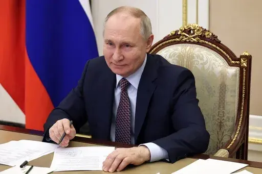 Russian President Vladimir Putin takes part in the opening ceremony of the Vostok (East) M-12 motorway to Kazan, via videoconference, in Moscow, Russia, Thursday, Dec. 21, 2023. Putin on Thursday, Jan. 4, 2024 signed a decree allowing for a quicker path to Russian citizenship for foreigners who enlist in the country's army amid the special military operation in Ukraine. (Mikhail Klimentyev, Sputnik, Kremlin Pool Photo via AP, File)