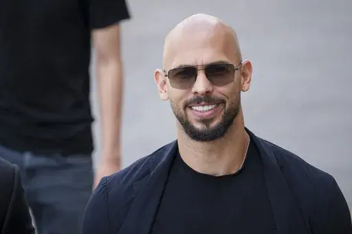 Andrew Tate arrives at the Court of Appeals building in Bucharest, Romania, Thursday, May 30, 2024. A judge says controversial social media personality Tate's defamation lawsuit against a Florida woman who accused him of imprisoning her in Romania can go to trial. (AP Photo/Andreea Alexandru, File)