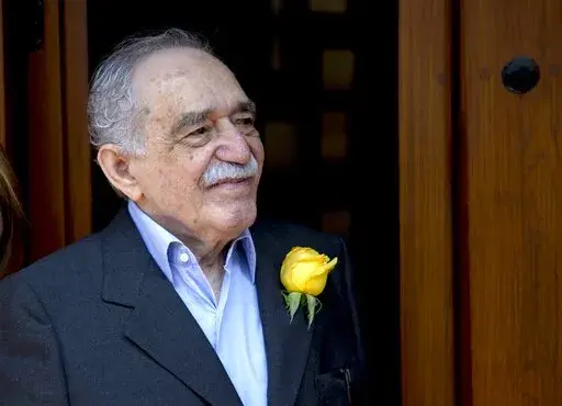 Colombian Nobel Literature laureate Gabriel Garcia Marquez greets fans and reporters outside his home on his 87th birthday in Mexico City, March 6, 2014. It was reported Sunday Jan. 16, 2022 that the late Garcia Marquez had a daughter out of wedlock in Mexico. (AP Photo/Eduardo Verdugo, File)